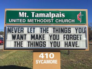 Sign Text: Never let the things you want make you forget the things you have.
