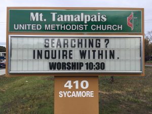 Sign Text: Searching? Inquire within. Worship 10:30am